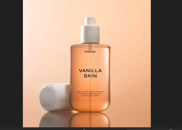 Phlur Vanilla Skin 240ml hair and body fragrance mist with a warm vanilla, sweet, floral, and woody scent profile.

