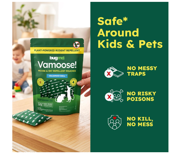 A sealed BugMD Vamoose! Pro rodent repellent pouch resting on a concrete garage floor beside a tire. The pouch is labeled for mice and rats and contains a plant-based essential oil blend on a volcanic pumice carrier.