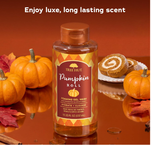 Promotional image of Tree Hut Pumpkin Roll Scented Body Wash, 18 fl oz, surrounded by pumpkins, pumpkin roll cake, cinnamon sticks, and autumn leaves. The graphic highlights everyday cleansing, seasonal fragrance, easy application, fall self-care, and gift ideas. It includes a reminder to check ingredients for sensitivities and a call to check Amazon for current availability.